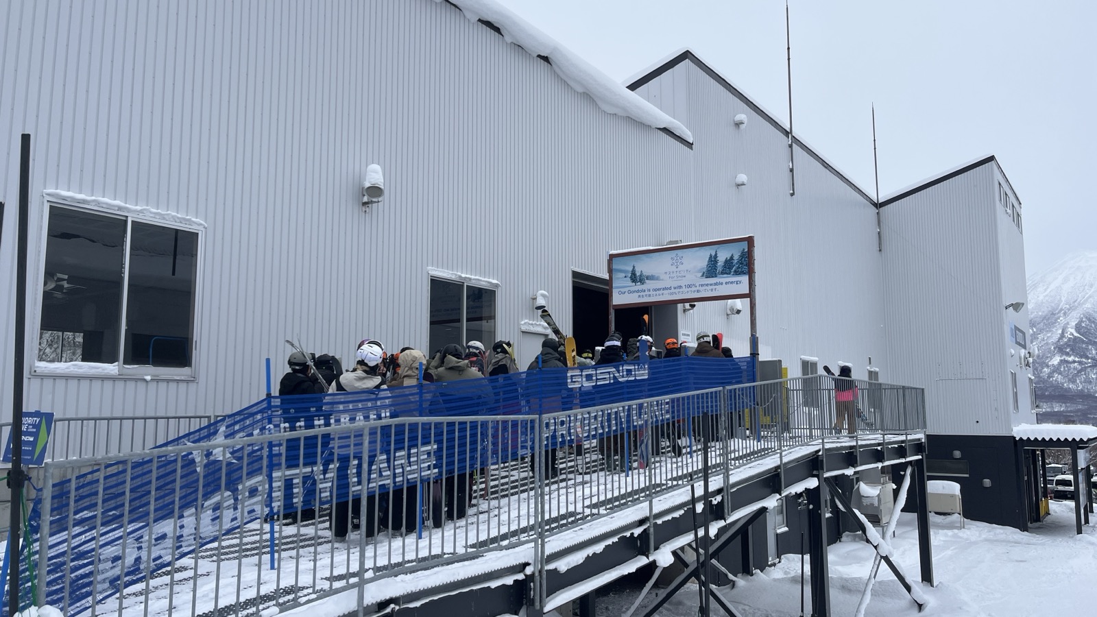 Riders queuing for the ACE Gondola at the Grand Hirafu lift station