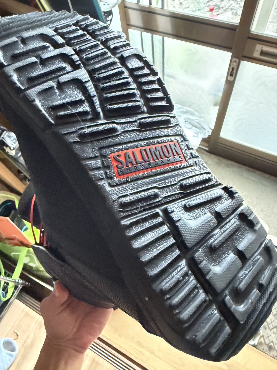 Close-up of a SALOMON SNOWBOARDS boot's rubber sole